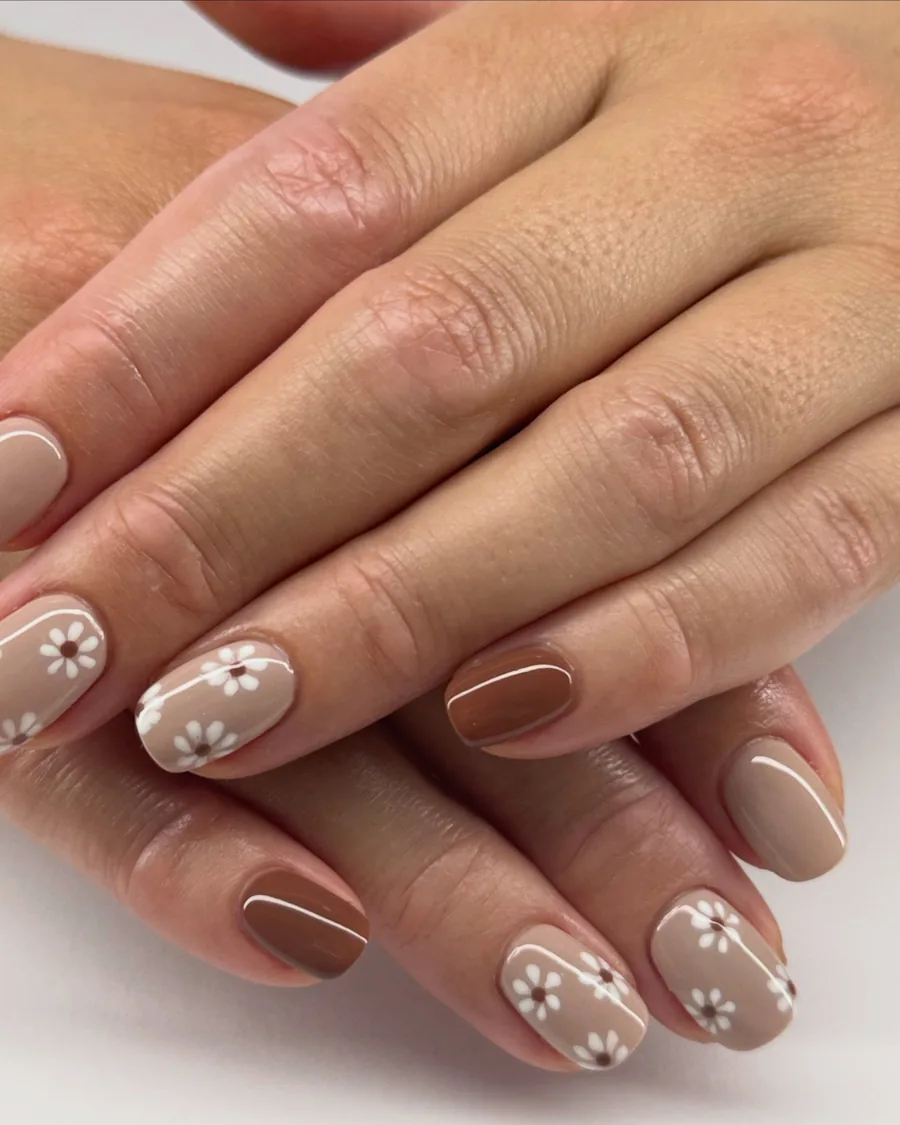 A finished Bio Sculpture gel set — soft nude with delicate white floral art
